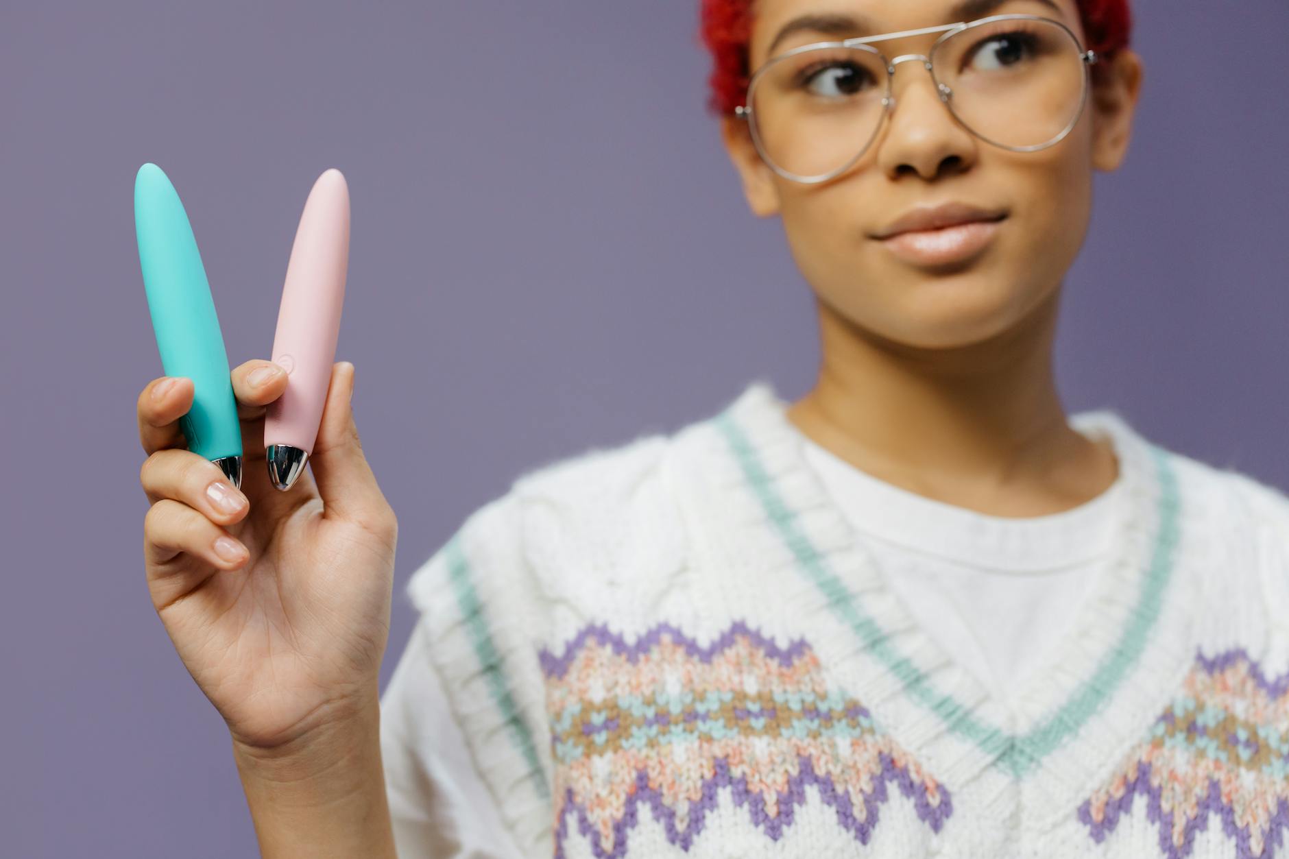A blue silicone lemon vibrator held in hand, representing personal pleasure and reconnection